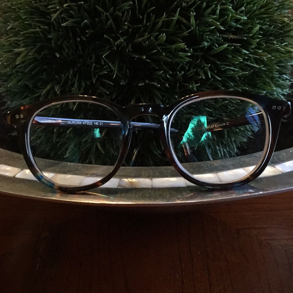 Dark tortoise shell with flecks of blue